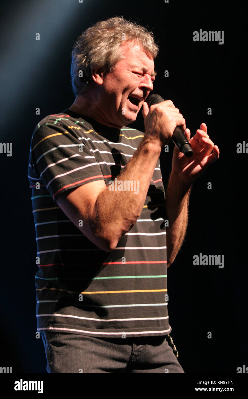 Deep Purple vocalist Ian Gillan is shown performing on stage during a 'live' concert appearance. Stock Photo