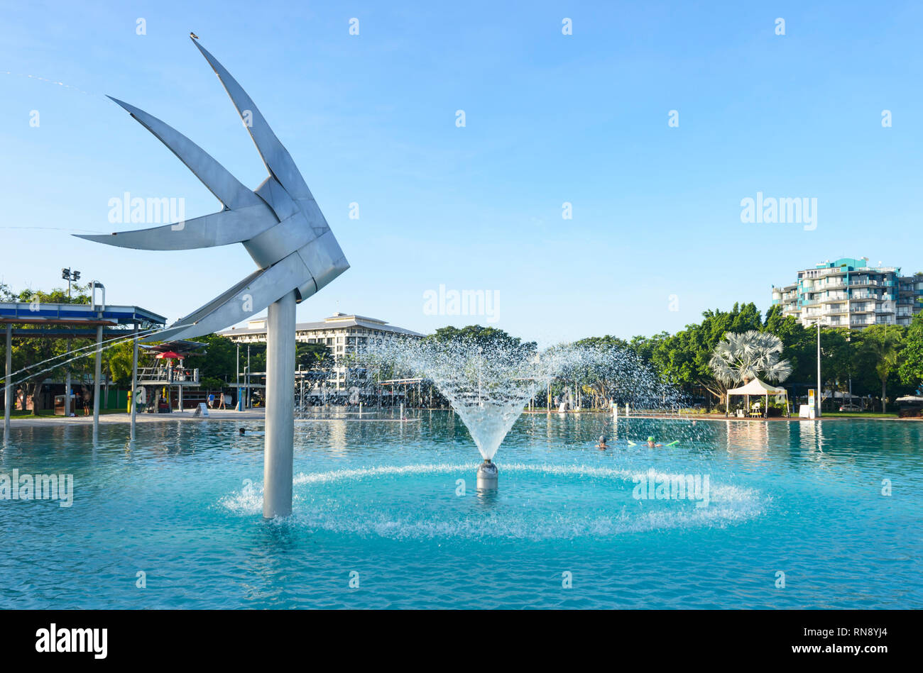 Fish sculpture and waterspout at the Lagoon, Cairns Esplanade, Far