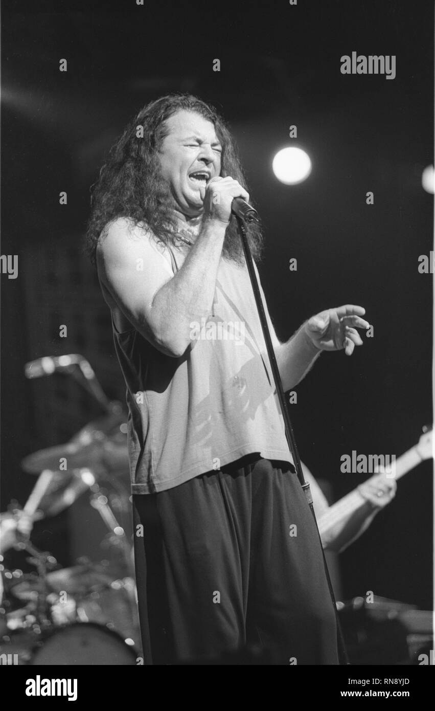 Deep Purple vocalist Ian Gillan is shown performing on stage during a 'live' concert appearance. Stock Photo