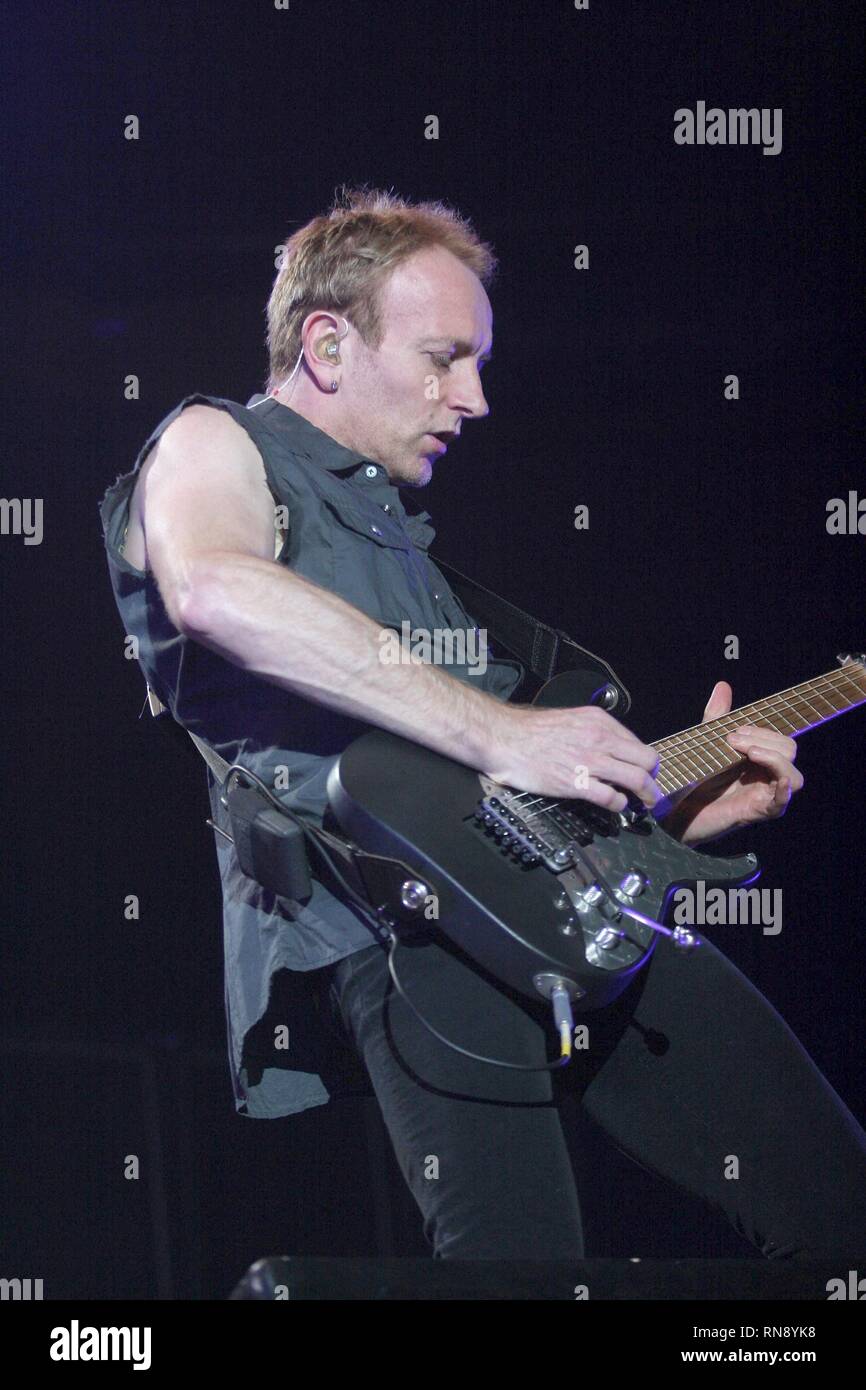 Def Leppard guitarist Phil Collen is shown performing on stage during a concert appearance. Stock Photo
