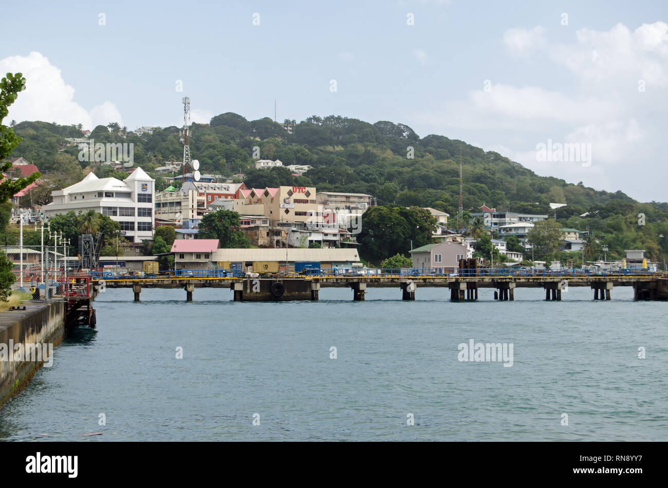 SCARBOROUGH, TRINIDAD AND TOBAGO - JANUARY 11, 2019:  Waterfront and pier at Scarborough on a cloudy afternoon. Stock Photo