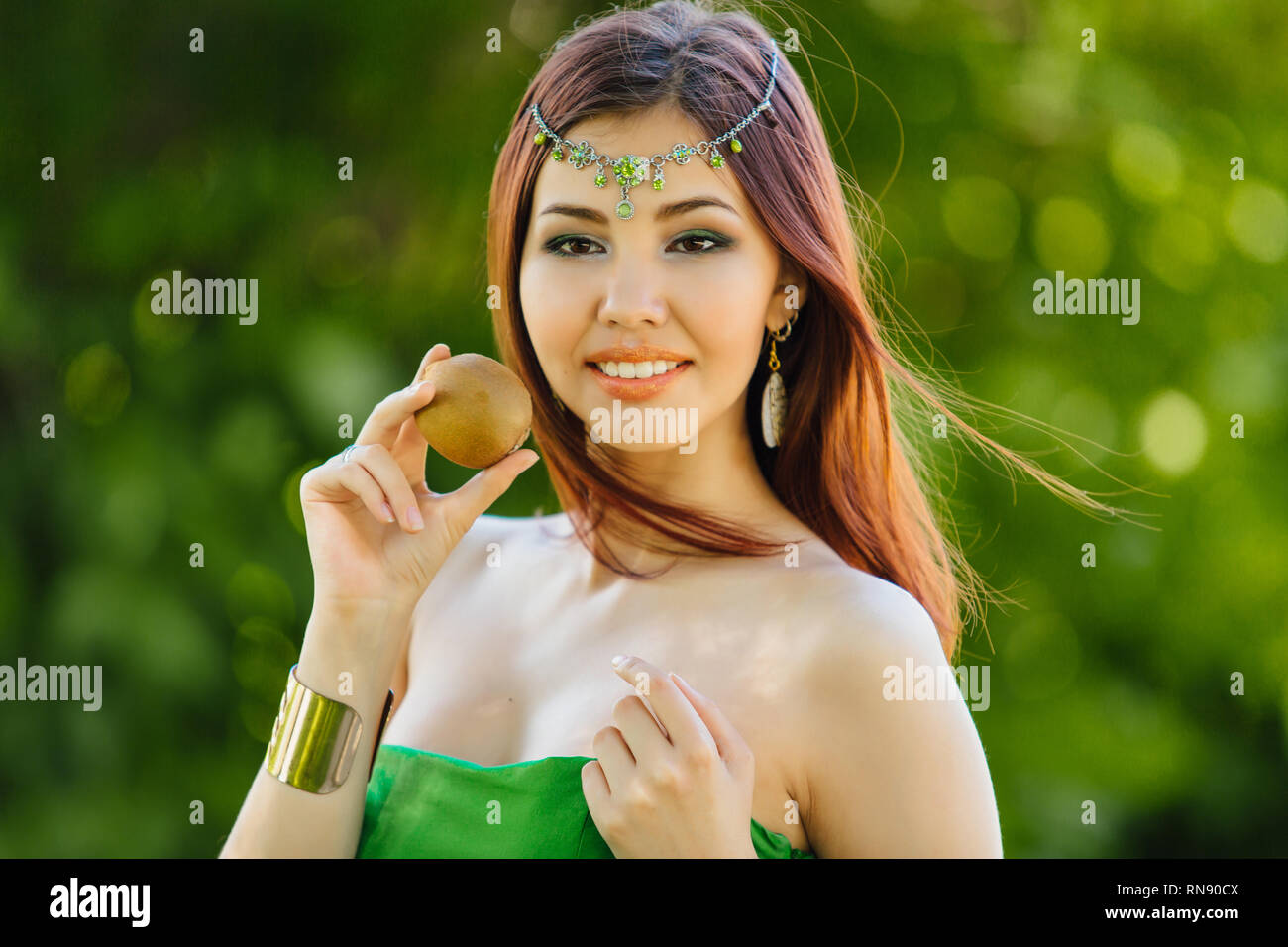 Portrait of a beautiful young asian woman dressed like a princess with ...