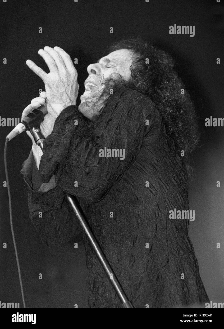 Singer Ronnie James Dio is shown performing on stage during a 'live' concert appearance. Stock Photo