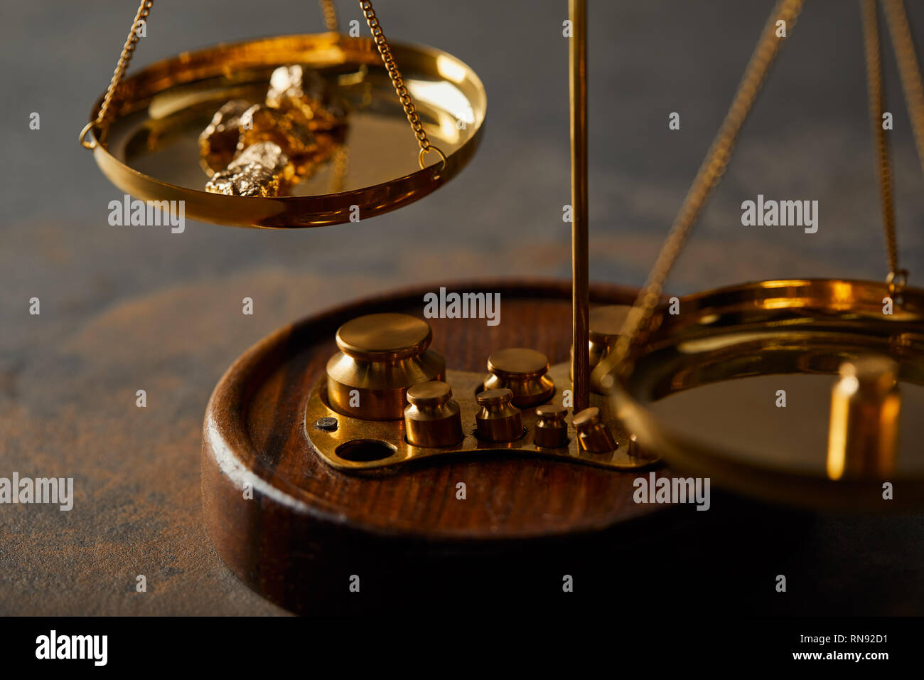 Scales With Rocks vintage scales with golden stones on textured marble background Stock ...