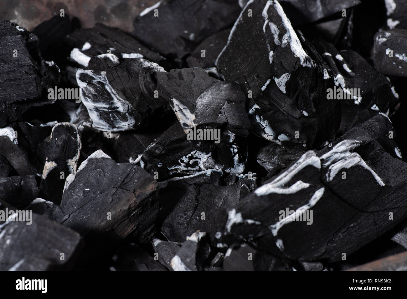 close up of black burnt textured charcoal with white ash Stock Photo ...