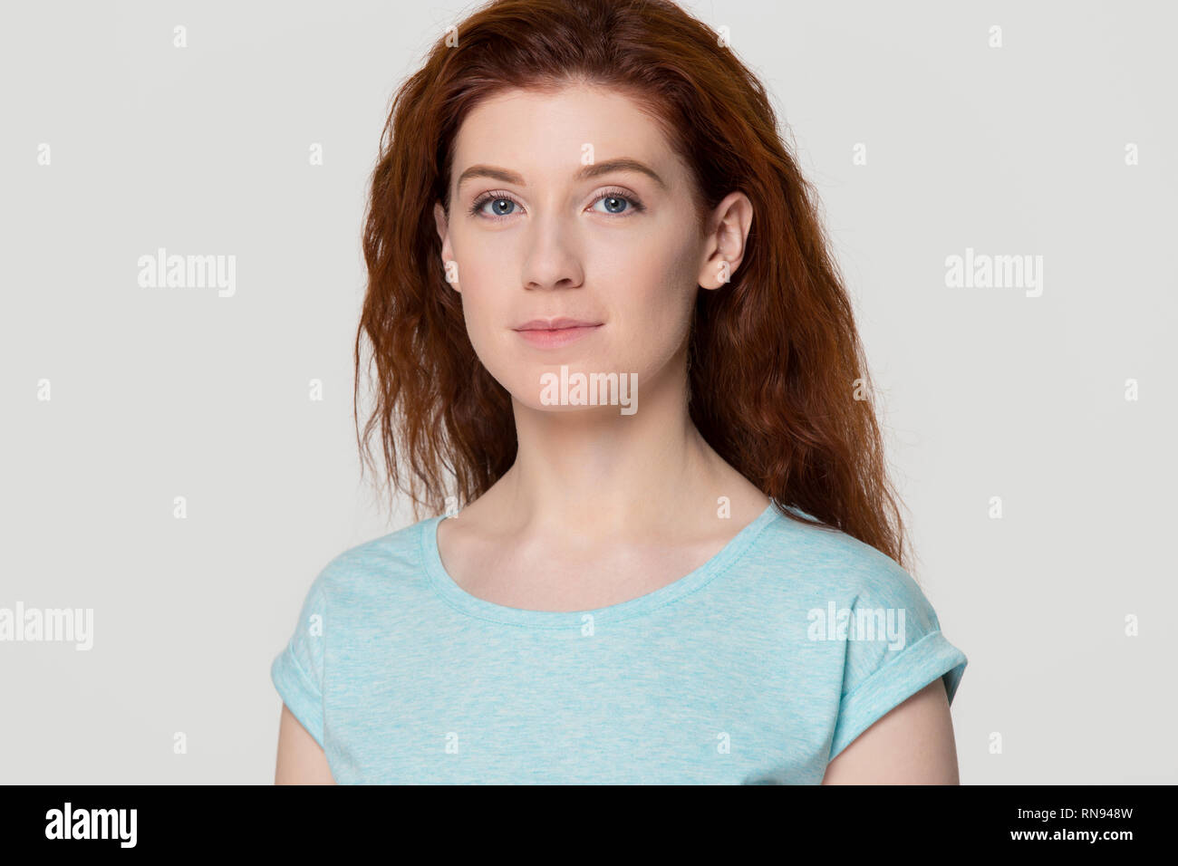 Headshot of young woman with beautiful face and red hair Stock Photo