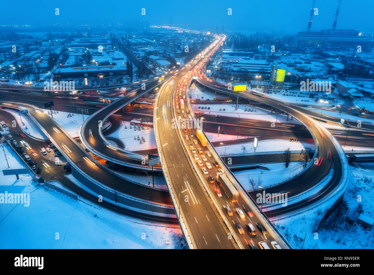 aerial-view-of-the-road-in-modern-city-at-night-in-fog-top-view-of