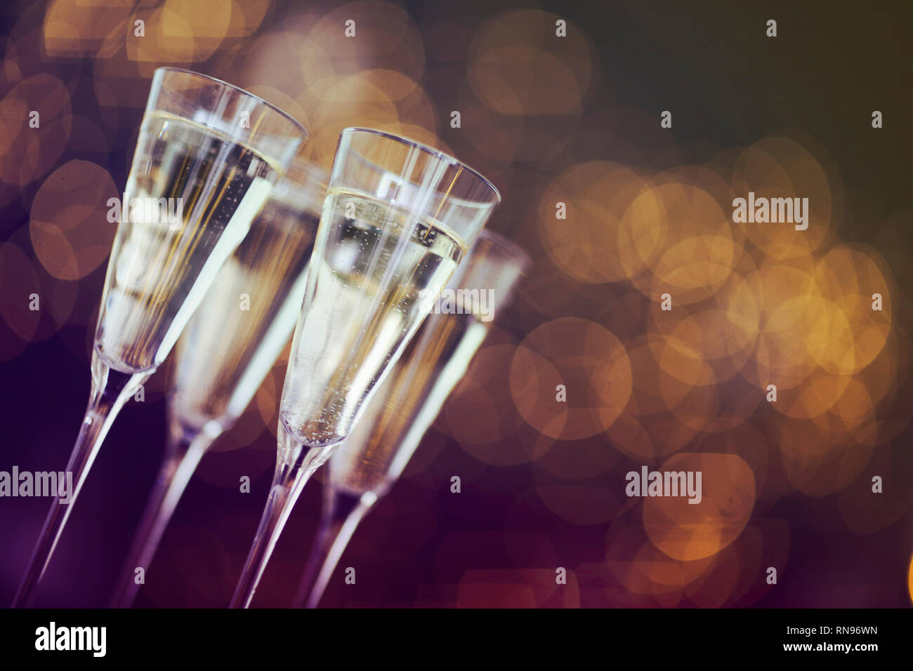 Champagne glasses on lights background. Celebration background Stock