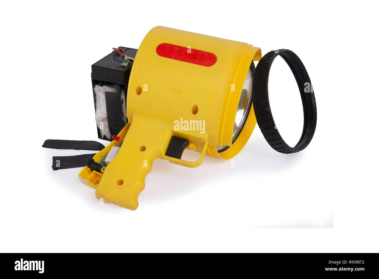 Damage flashlight by overload charging make battery explosion on white background Stock Photo