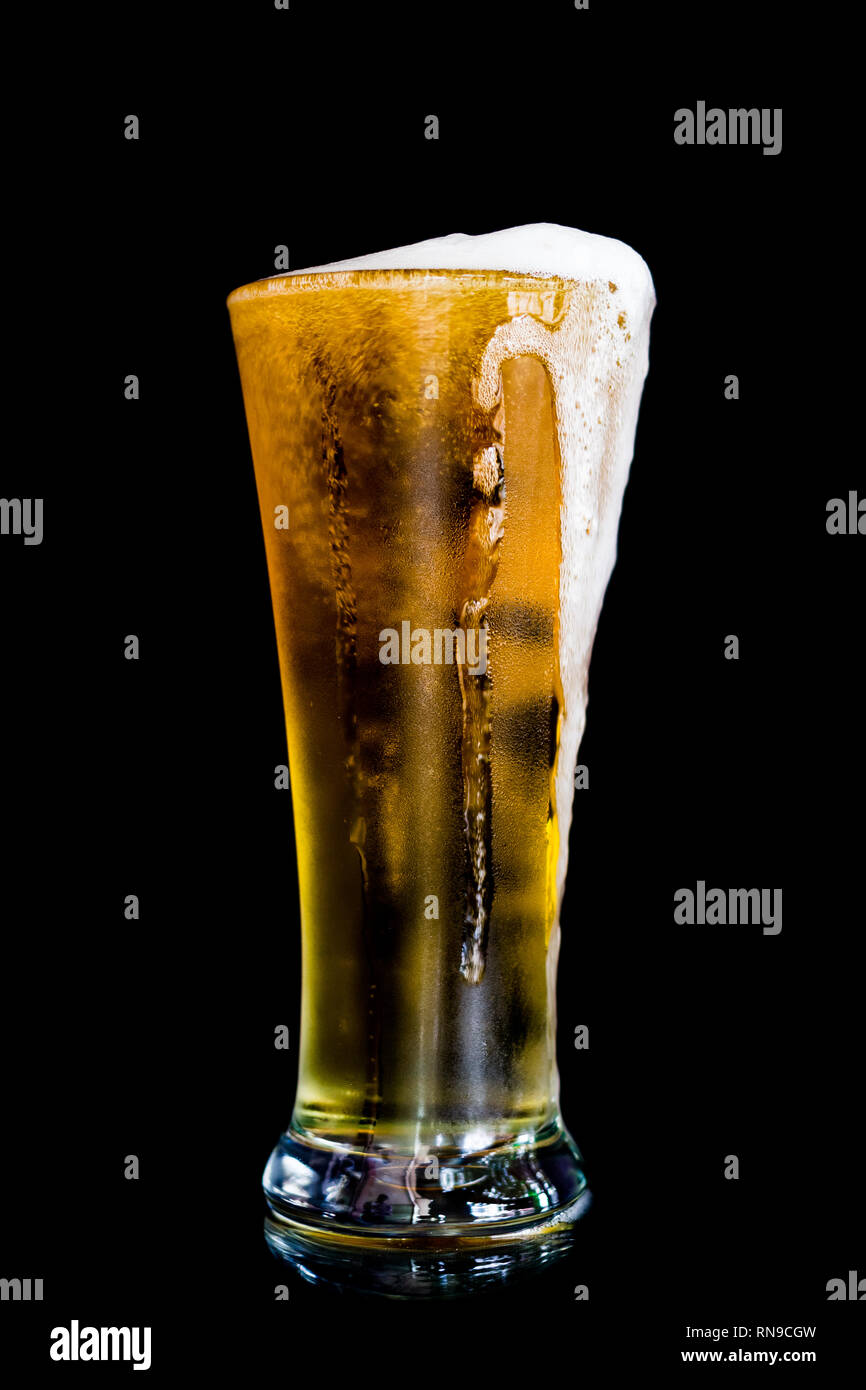 Beer on black background Stock Photo - Alamy