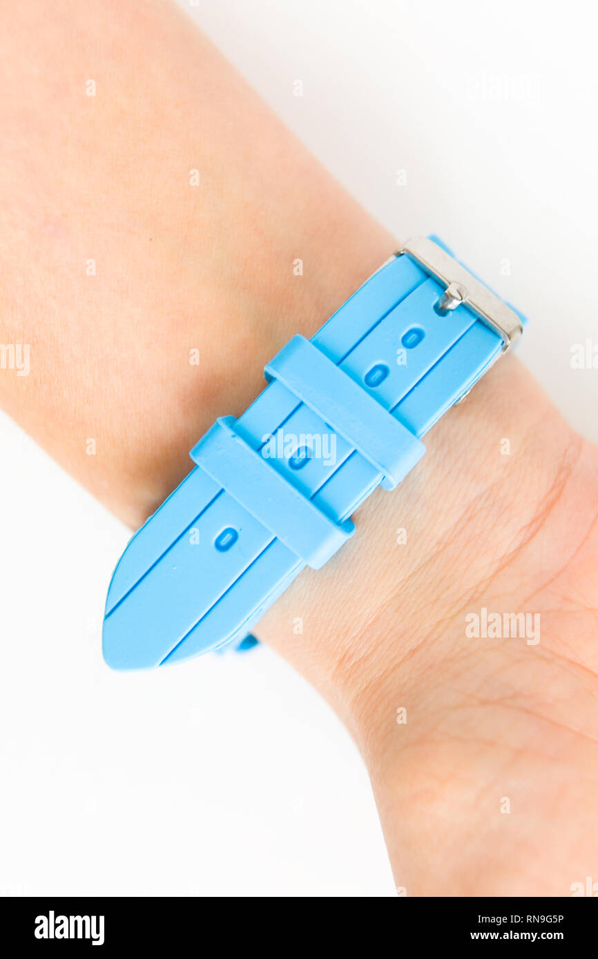 Blue silicone strap on the female wrist. Closeup Stock Photo Alamy