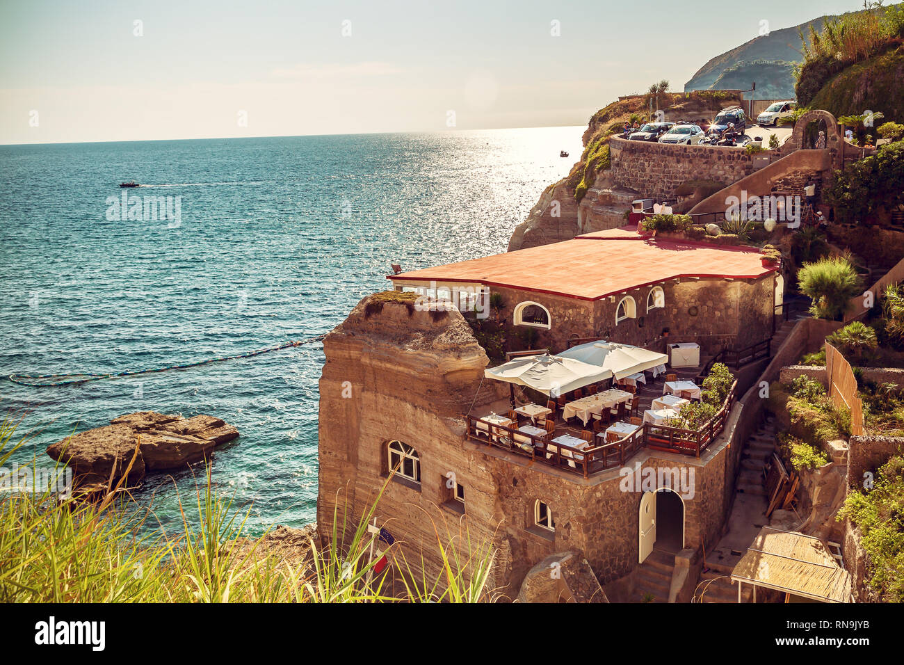 Panoramic view with Restaurant on the sea at the village of Sant'Angelo on  the Ischia island. Travel in Italy. Famous landmark and tourist destination  Stock Photo - Alamy
