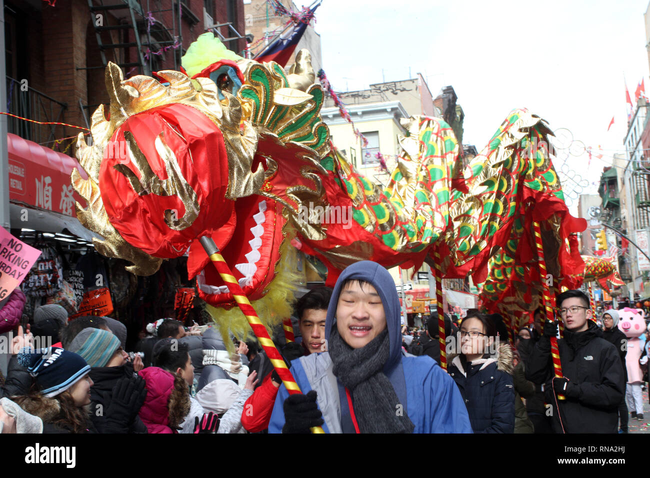 New York, New York, USA. 17th Feb, 2019. A Dragon dances for thousands that packed the streets of Chinatown on Sunday to celebrate the Lunar New Year during the Chinatown Lunar New Year Parade and Festival in New York City. Colorful lions and dragons dance bringing prosperity and good luck as the year of the pig begins. They are also meant to scare away the old spirit. Credit: Bruce Cotler/Globe Photos/ZUMA Wire/Alamy Live News Stock Photo