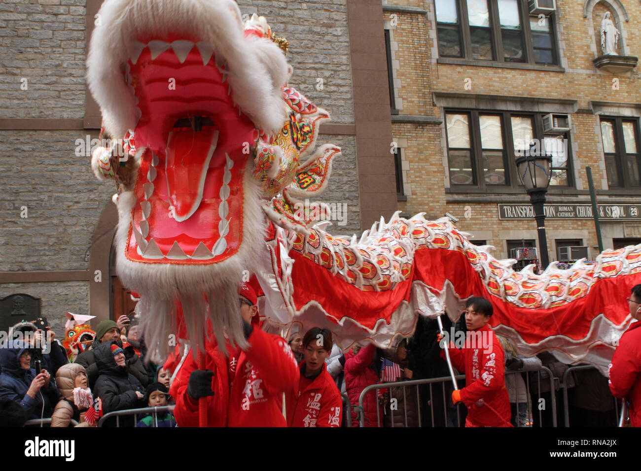 New York, New York, USA. 17th Feb, 2019. A Dragon dances for thousands that packed the streets of Chinatown on Sunday to celebrate the Lunar New Year during the Chinatown Lunar New Year Parade and Festival in New York City. Colorful lions and dragons dance bringing prosperity and good luck as the year of the pig begins. They are also meant to scare away the old spirit. Credit: Bruce Cotler/Globe Photos/ZUMA Wire/Alamy Live News Stock Photo