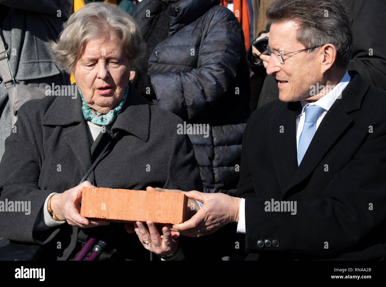 18 February 2019, Brandenburg, Potsdam: Marianne von Weizsäcker, widow of the Federal President Richard von Weizsäcker, who died in 2015, and Wolfgang Huber, Chairman of the Board of Trustees of the Garrison Church Foundation, will be holding a brick for the tower of the church during an event to mark the start of construction on the church tower. Like the original, which was blown up in 1968 at the behest of the GDR leadership, the church tower is to be bricked up to a height of almost 90 metres with around 2.3 million bricks. Photo: Ralf Hirschberger/dpa Stock Photo