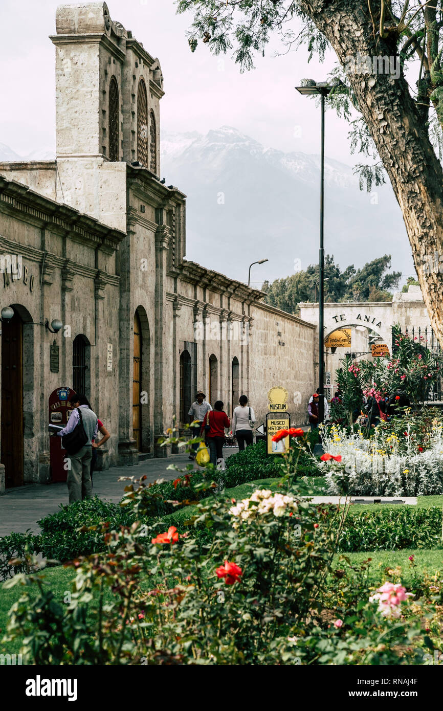 Park with historical building and volcano Misti in the background in Arequipa, Peru. Stock Photo