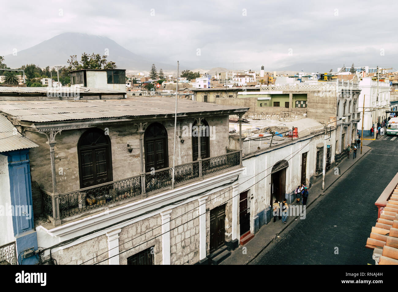 Street view with volcano Misti in the background in Arequipa, Peru. Stock Photo