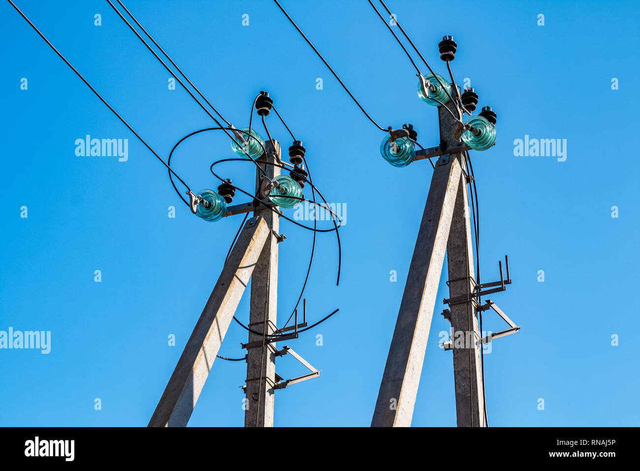 Concrete poles with electrical wires and highvoltage distribution
