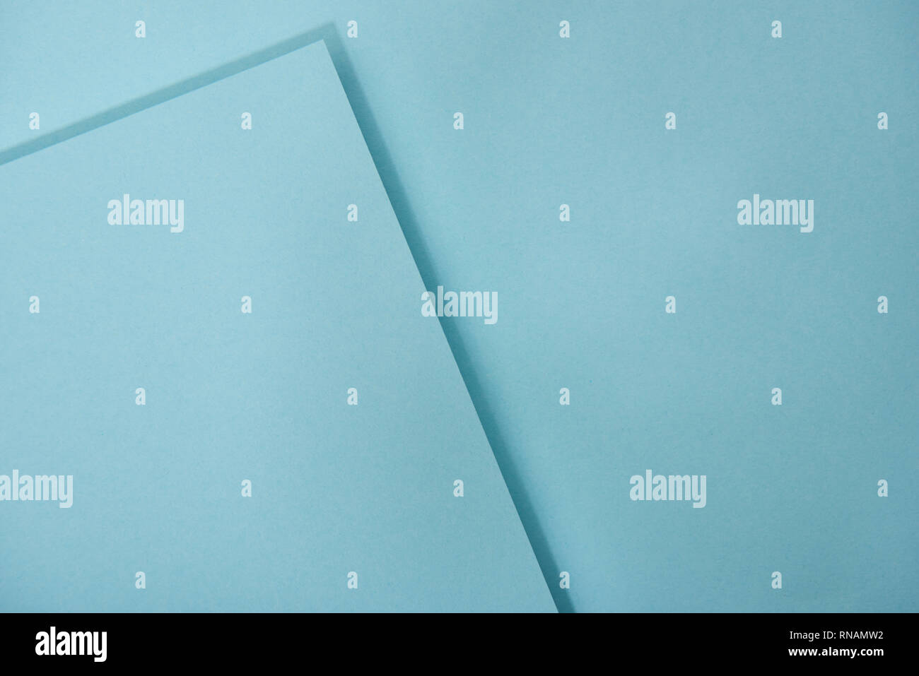top view of blue laid out paper sheets with copy space Stock Photo