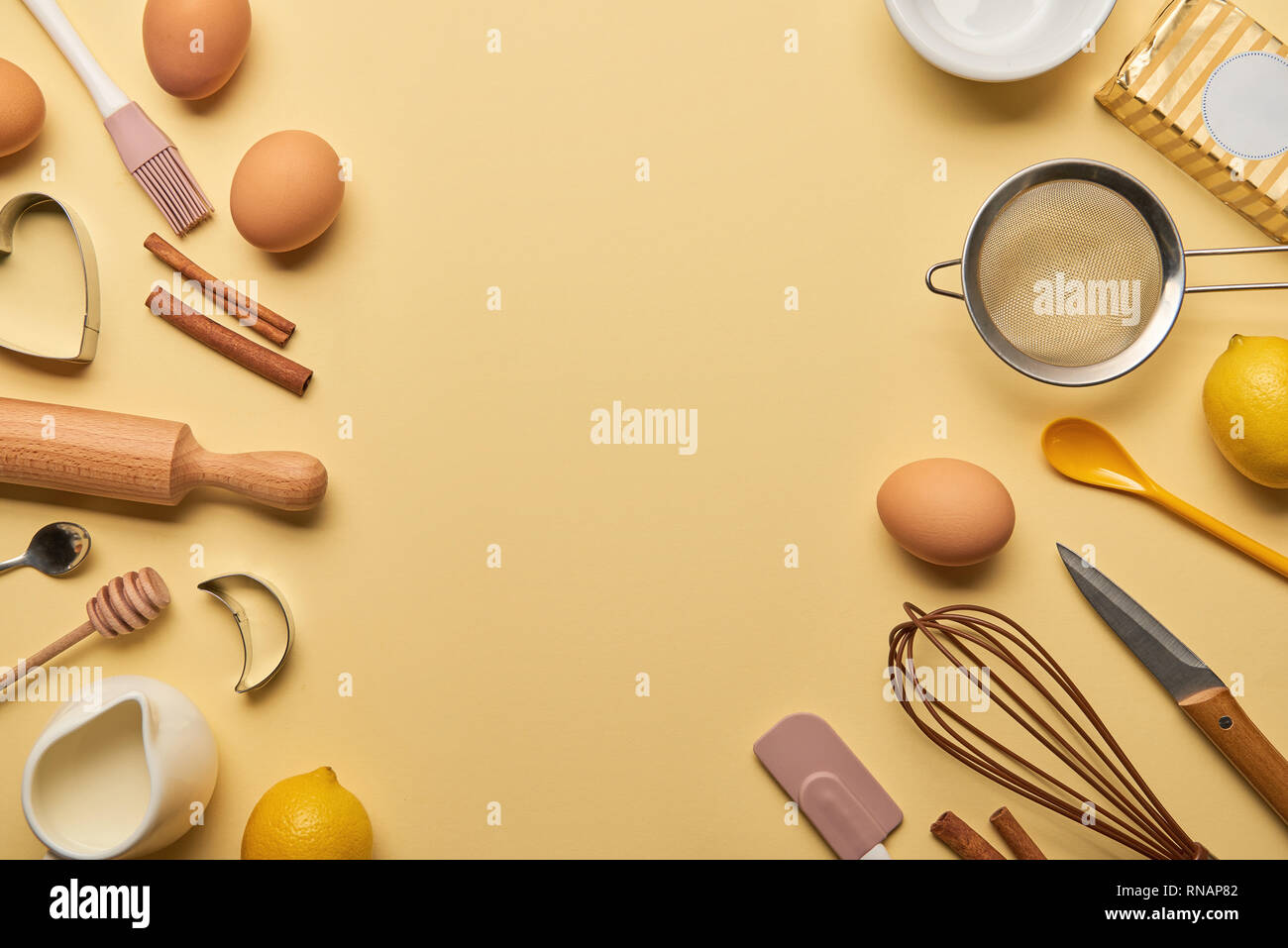 Download Top View Of Bakery Ingredients And Kitchenware On Yellow Background Stock Photo Alamy PSD Mockup Templates