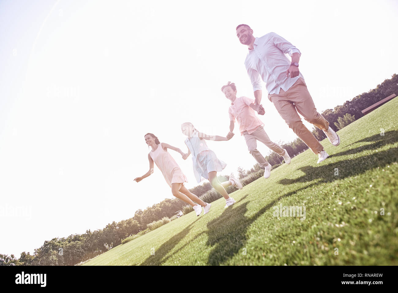 Four Glad Kids Happily Playing Running Stock Photo 740951944