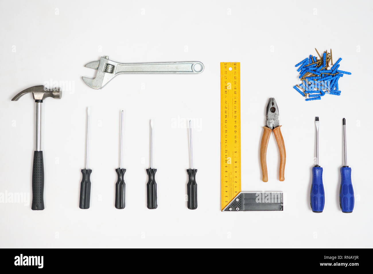 Tools and nails in composition on white background Stock Photo