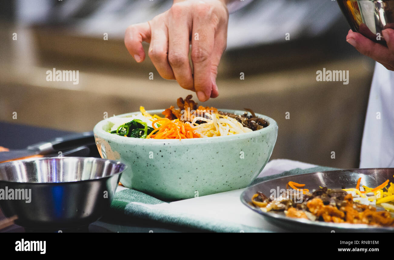 Bibimbap, Traditional Korean cuisine bibimbap, Chef preparing Korean ...