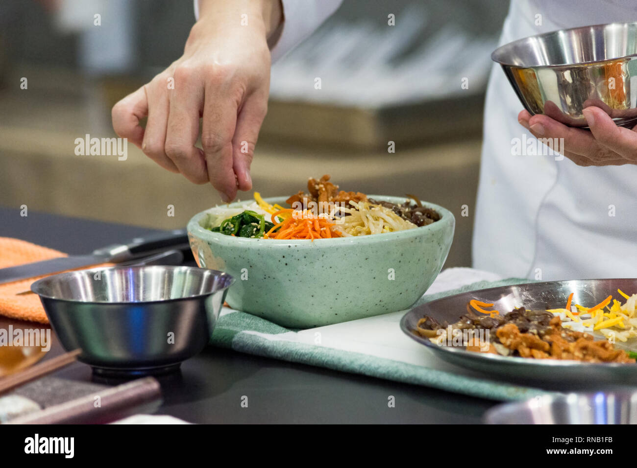 Bibimbap, Traditional Korean cuisine bibimbap, Chef preparing Korean ...