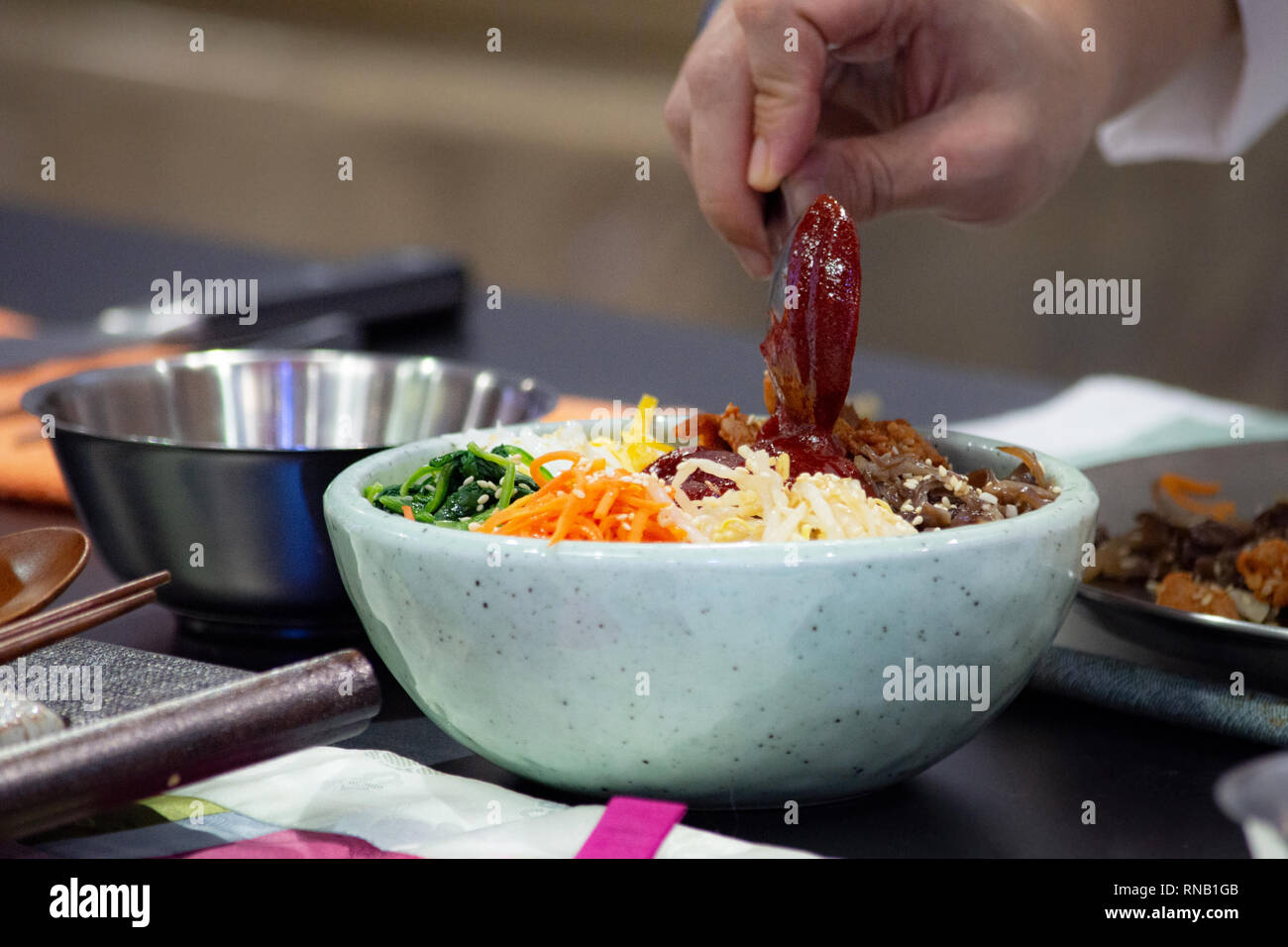 Bibimbap, Traditional Korean cuisine bibimbap, Chef preparing Korean ...