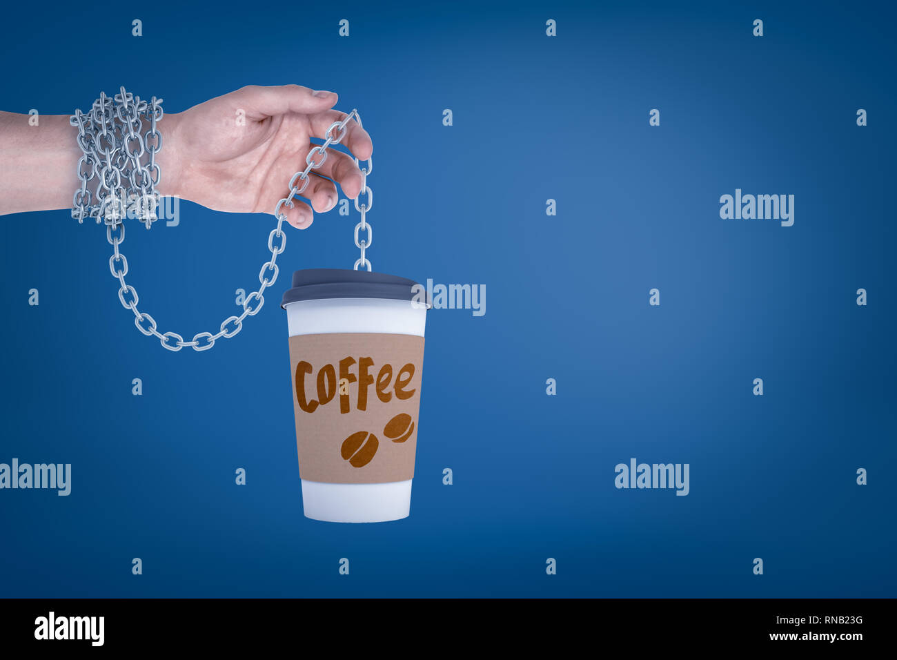 Close-up of hand holding coffee paper cup on metal chain which is also wrapped around wrist. Stock Photo