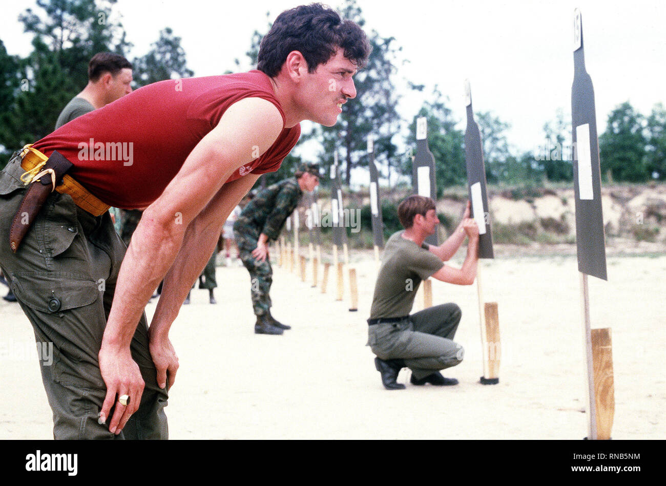 A Royal Canadian Air Force member checks his target for accuracy at the ...