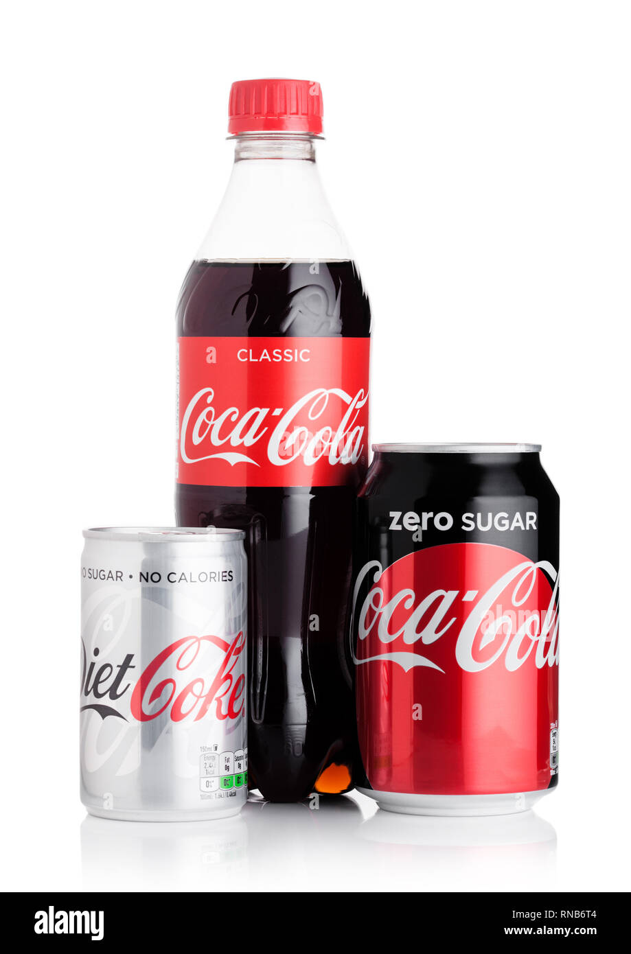 LONDON, UK - FEBRUARY 06, 2019: Bottle and aluminium cans of Original Coca Cola soft drink on white. Stock Photo