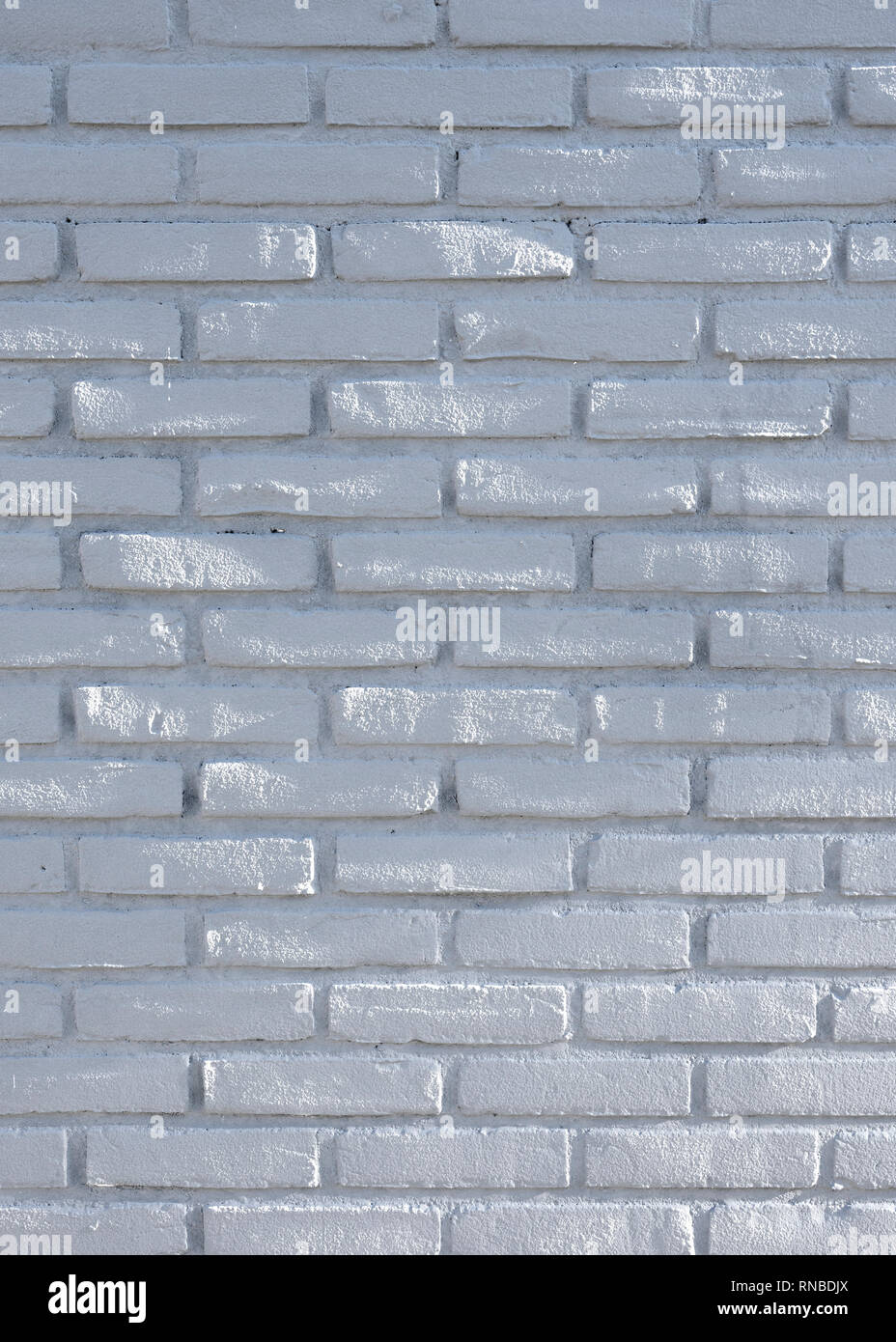 part of white grey brick wall with spots of sunlight Stock Photo Alamy