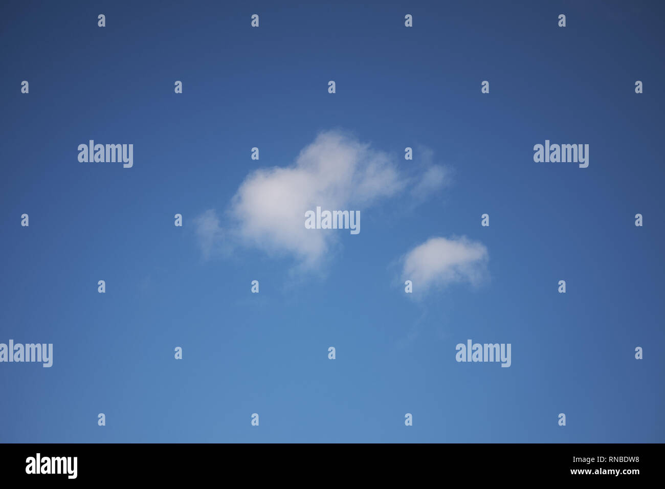An isolated white cloud in a blue sky Stock Photo