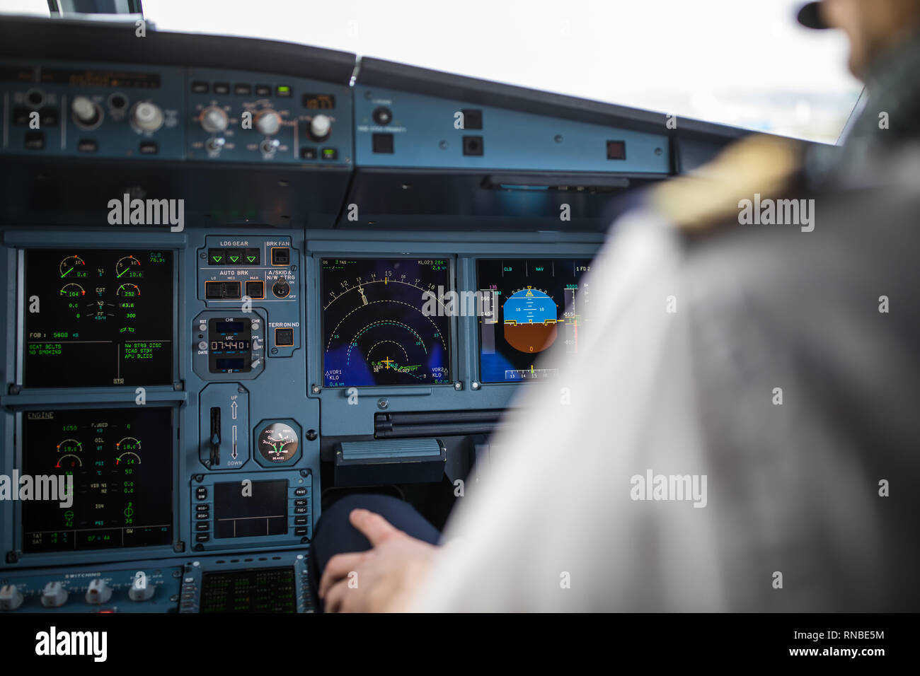 Pilot's hand accelerating on the throttle in a commercial airliner ...