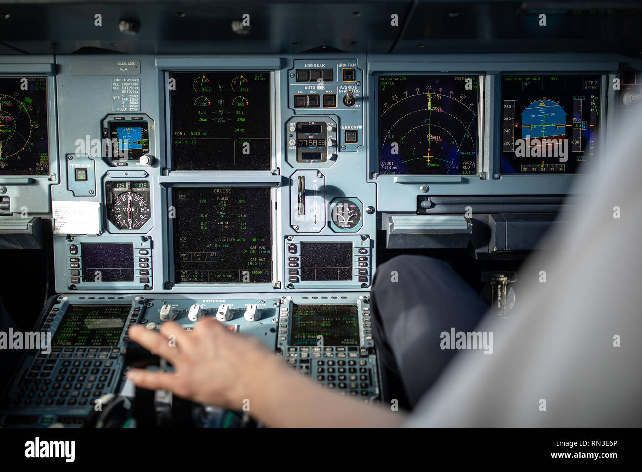 Pilot's hand accelerating on the throttle in a commercial airliner ...