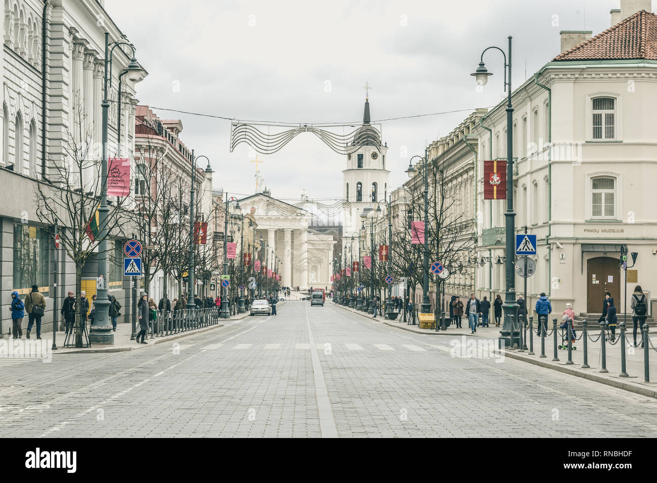 Vilnius, Lithuania - March, 11, 2017: Main shopping street to  Cathedral square with bell tower in  Vilnius, Lithuania Stock Photo