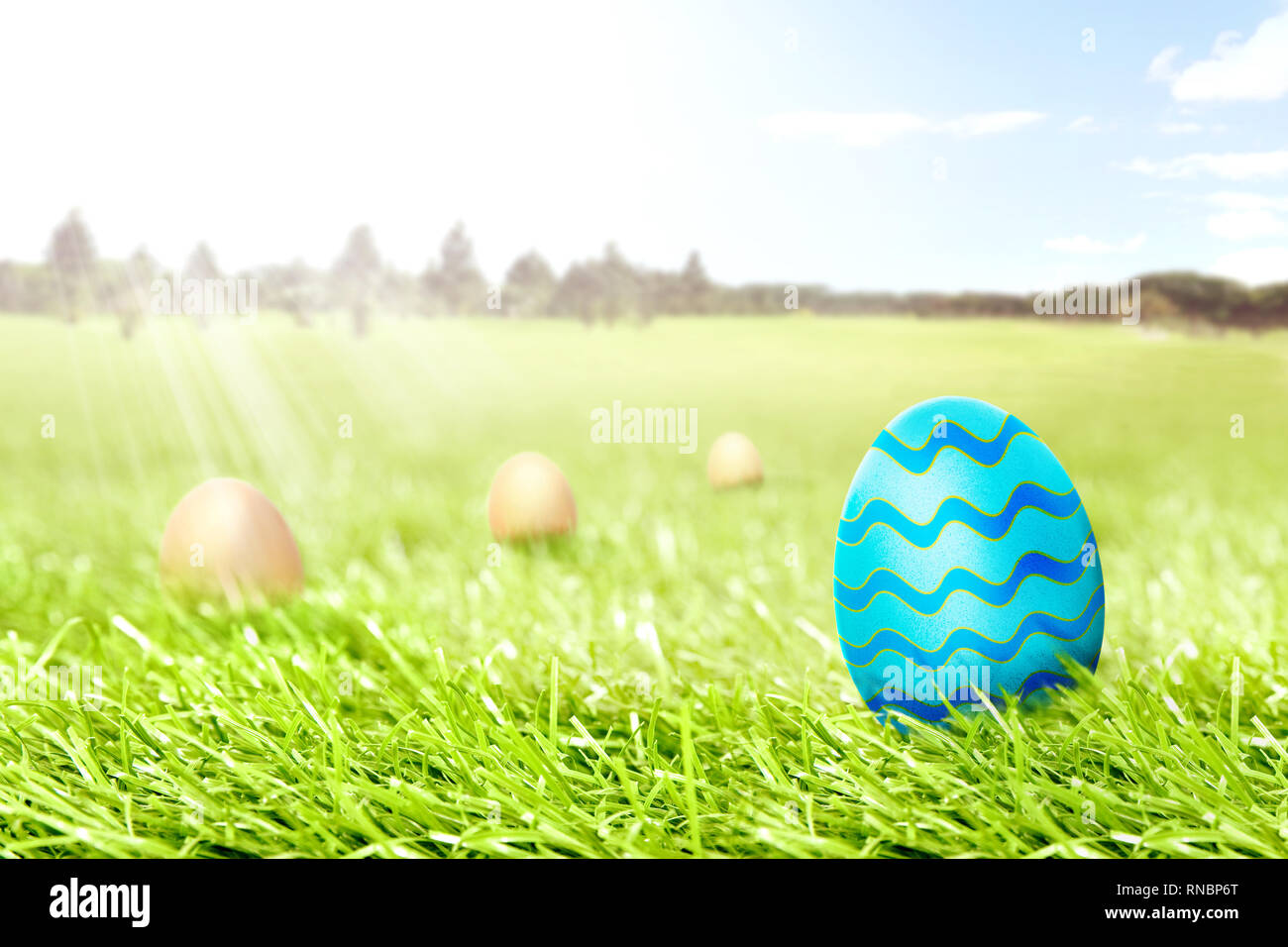 Colorful easter eggs hidden in the grass field with trees and blue sky ...