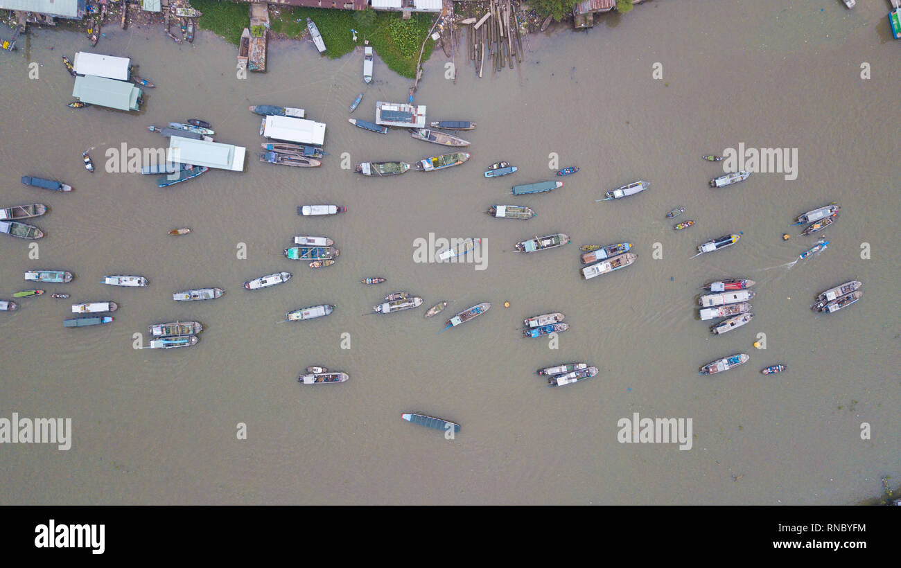 Aerial view, top view Cai Rang floating market. Tourists, people buy and sell food, vegetable, fruits on boat, ship at river market Stock Photo