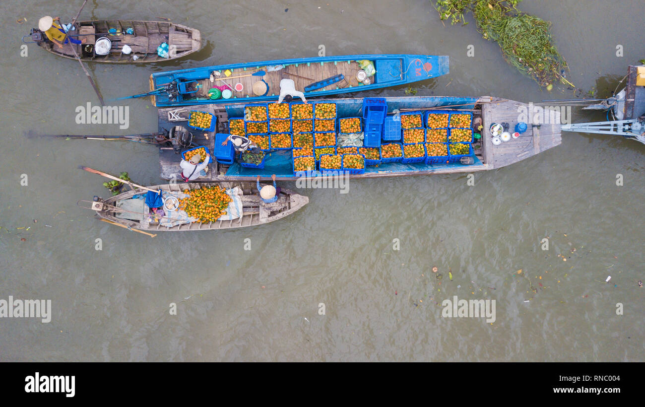 Aerial view, top view Cai Rang floating market. Tourists, people buy and sell food, vegetable, fruits on boat, ship at river market Stock Photo