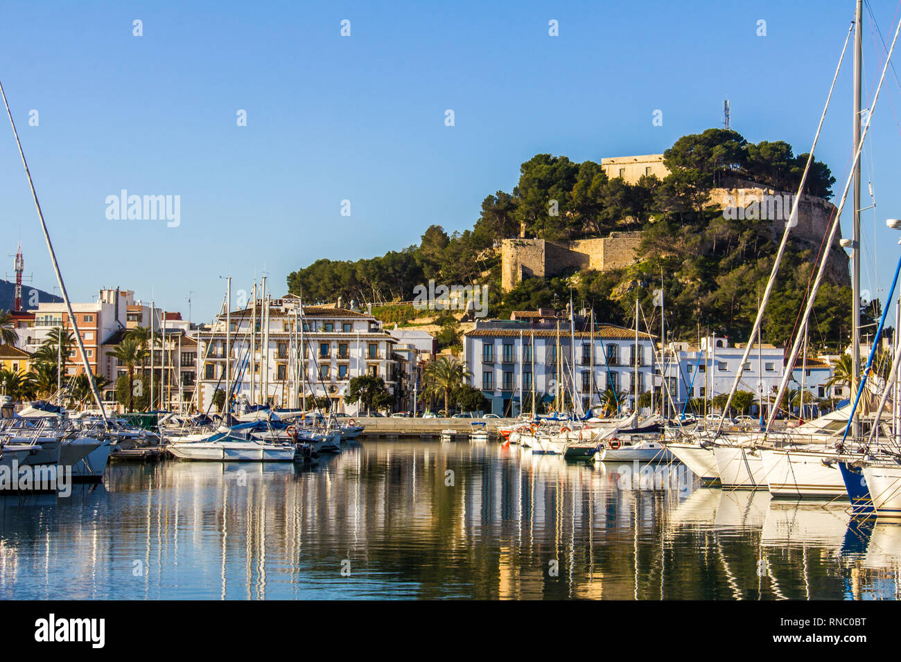 Panoramic view of Denia Port Marina promenade and Castle Stock Photo