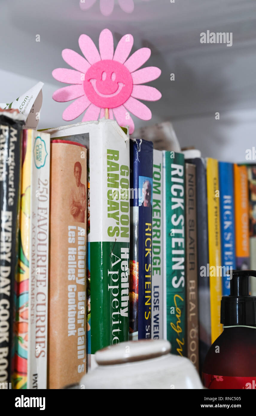 Celebrity chef cookery books on kitchen shelf Stock Photo