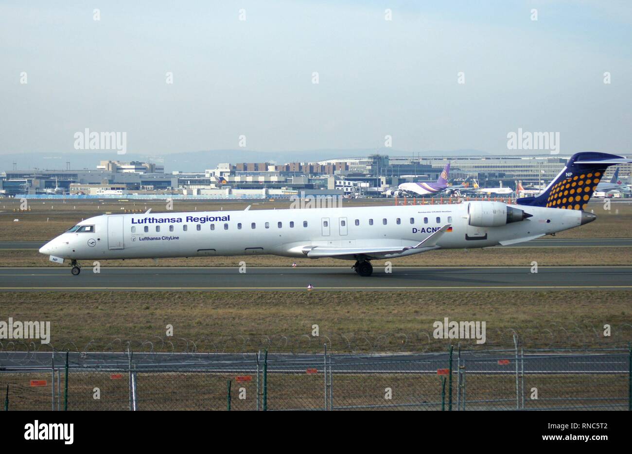Frankfurt Airport. Frankfurt Rhine-Main Airport. A narrow-body aircraft Bombardier CRJ900 NextGen of the German airline Lufthansa Regional, rolls to a parking position on the south side of the airport. | usage worldwide Stock Photo