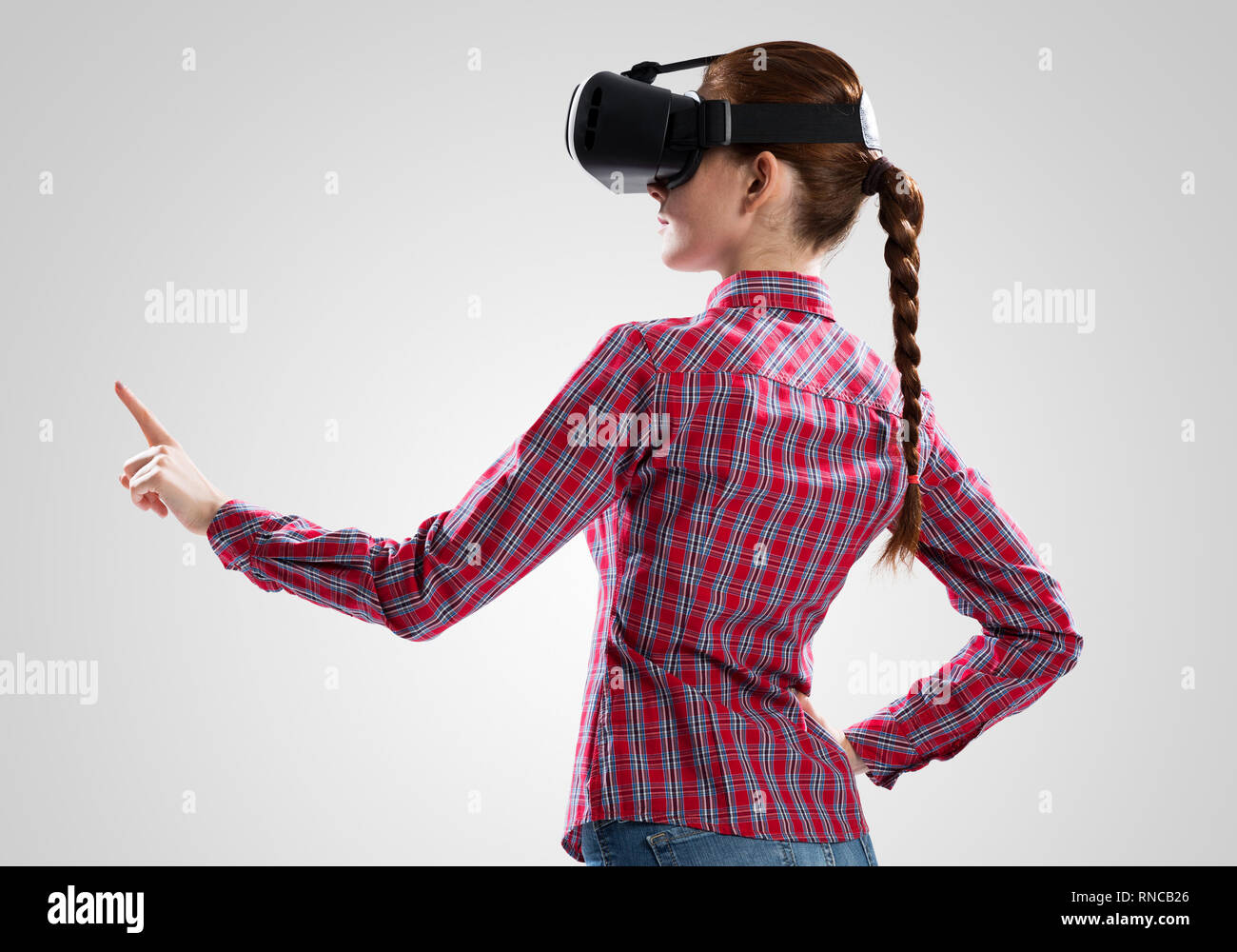 Girl in mask experiencing virtual reality as new entertainment device ...