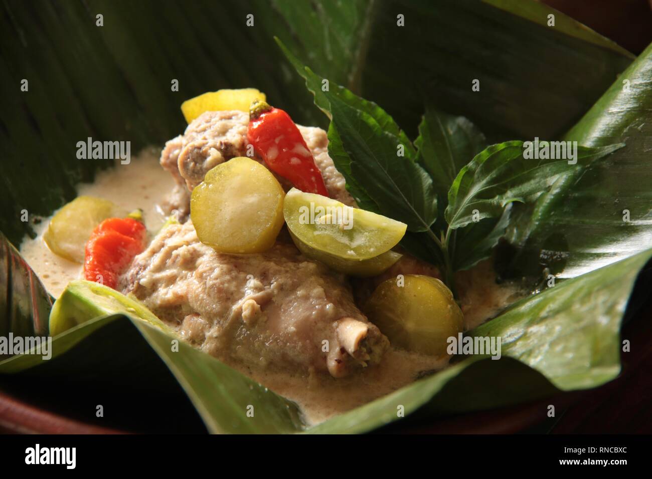Garang Asem Ayam Traditional Javanese Dish Of Tangy Chicken Curry In Banana Leaf Pouch Stock Photo Alamy