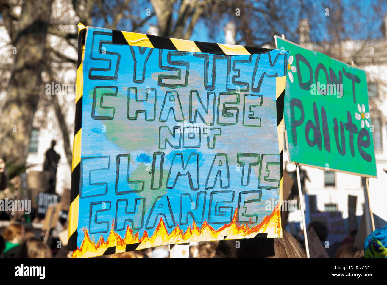 Protestors holding climate change banners at a protest Stock Photo