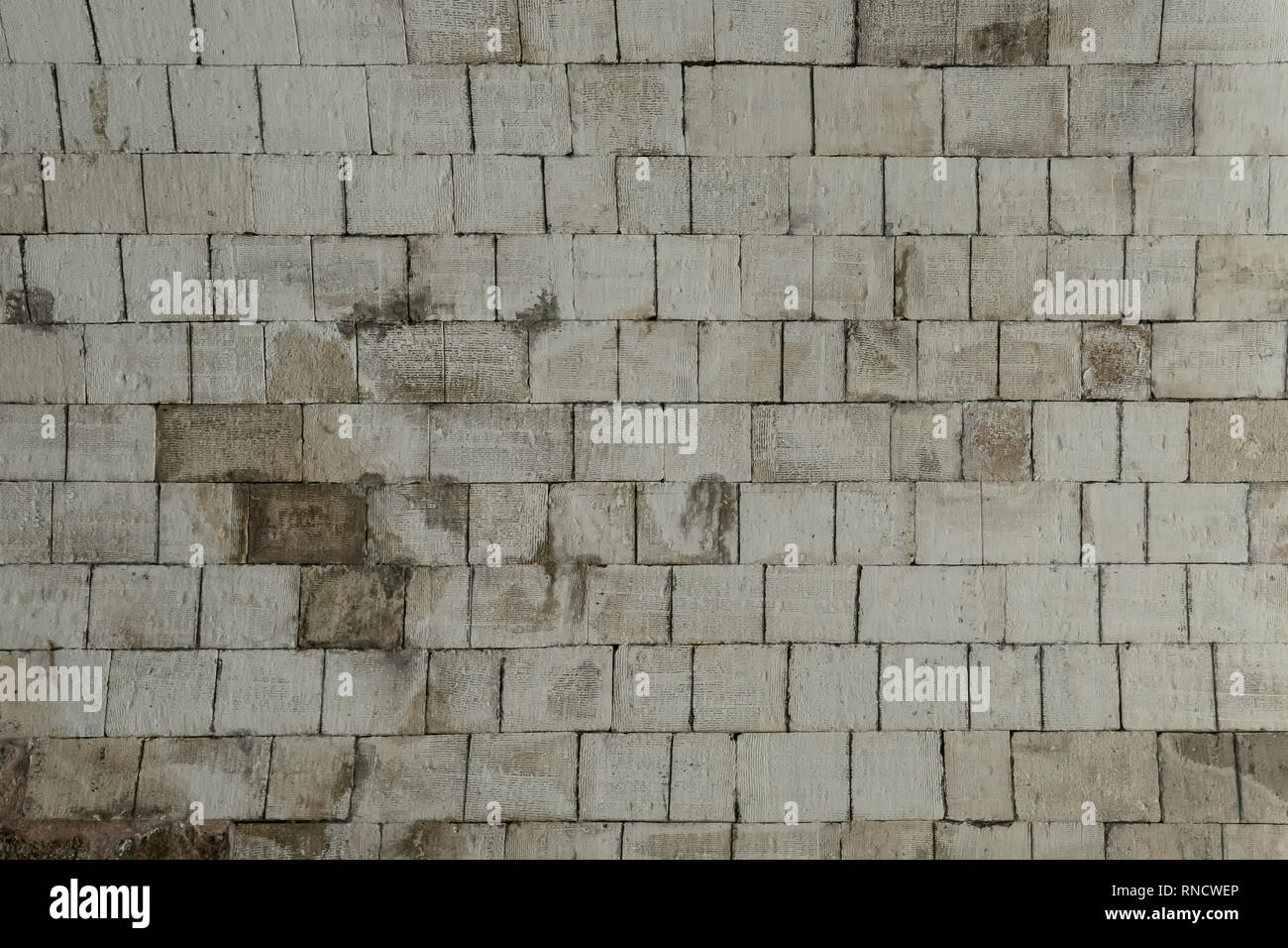 Gray stone bricks, wall texture, rocky surface closeup. Decorative