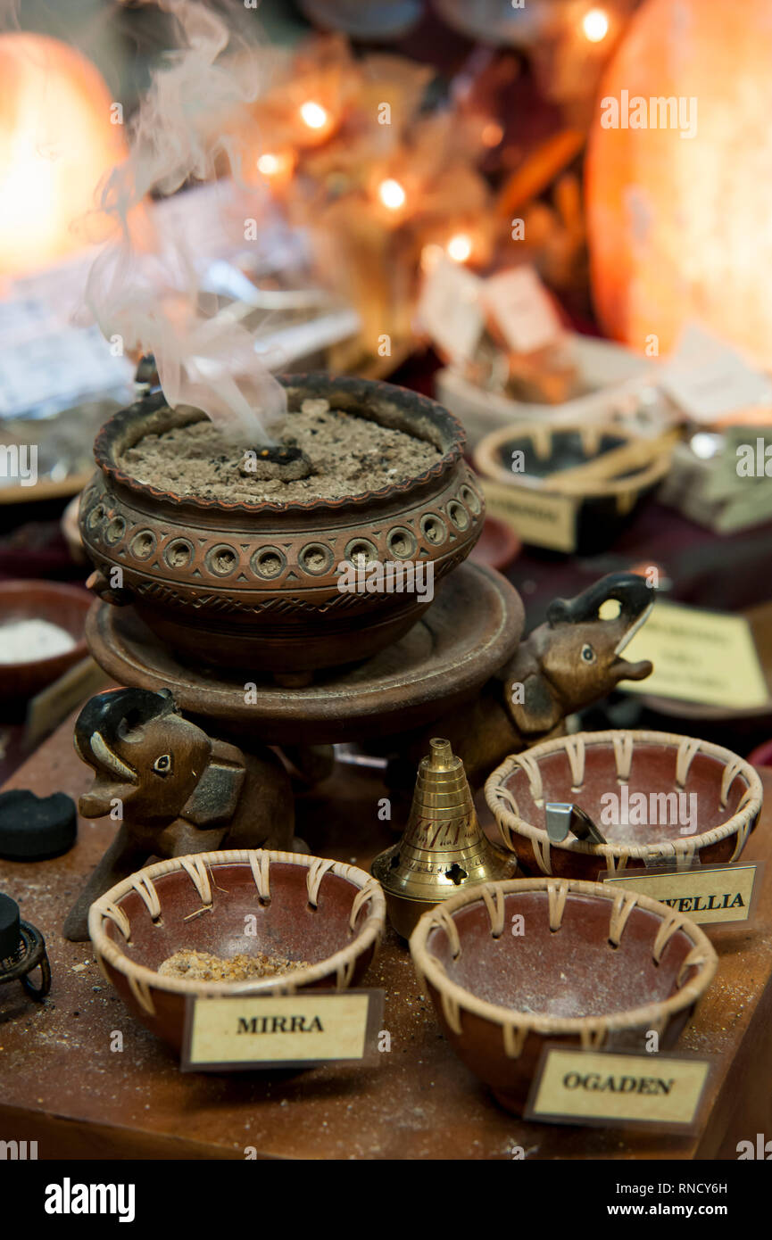 the brazier diffuses the scent of incense in the room Stock Photo