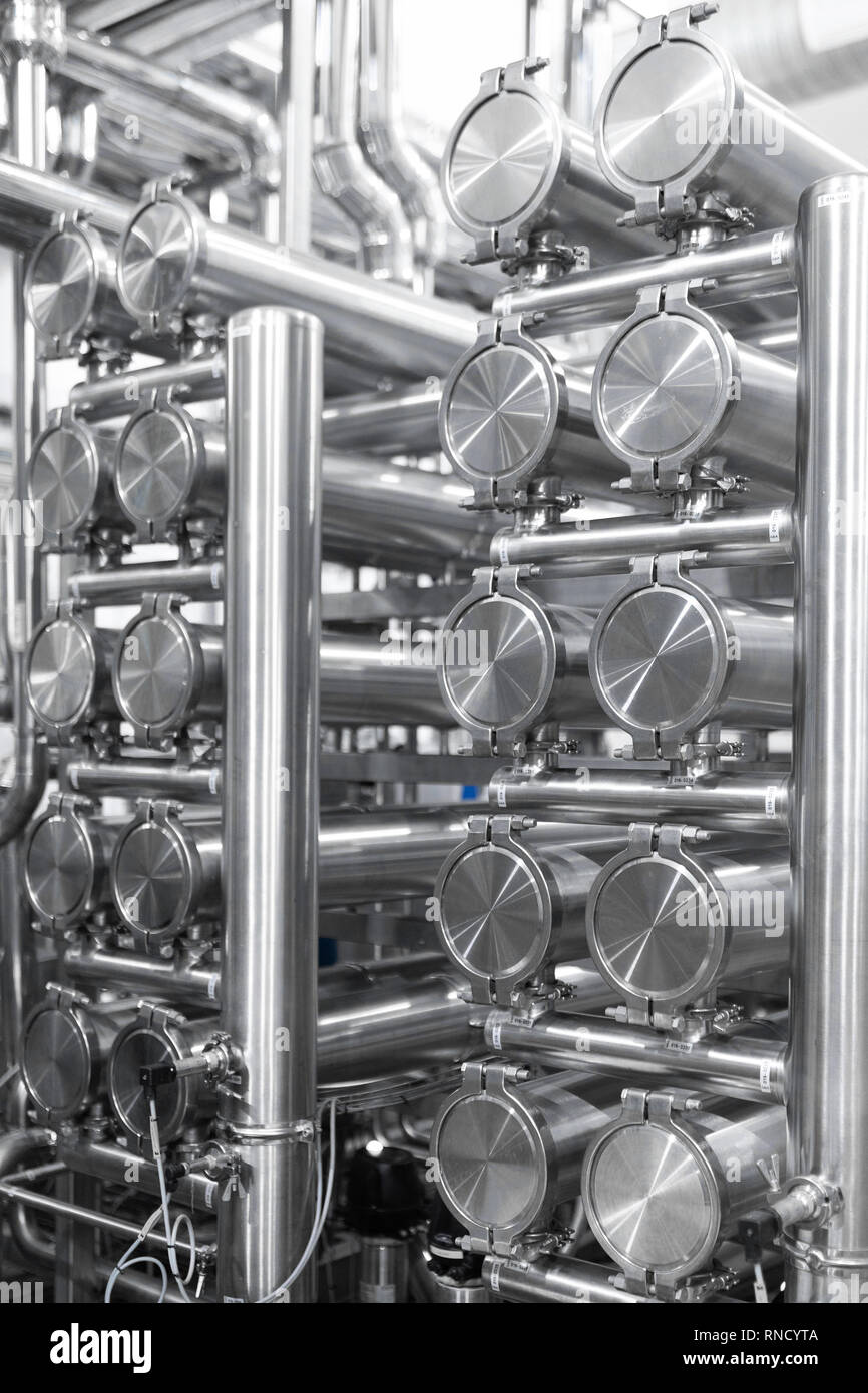 Chrome pipes close-up. Industrial background Stock Photo - Alamy