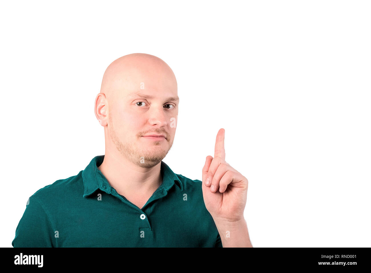 Young man pointing finger up and having an idea Stock Photo